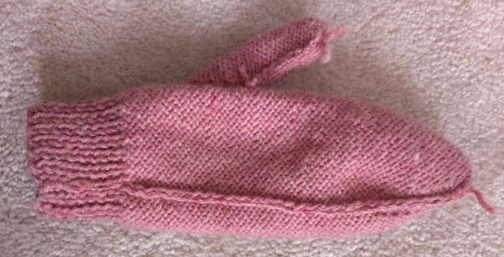 The seam for the two needle mittens. 