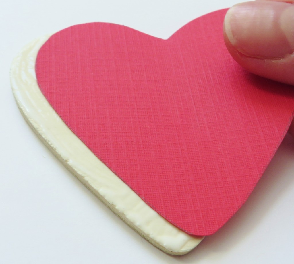 Step 3: Apply the cut hearts to the wooden hearts.