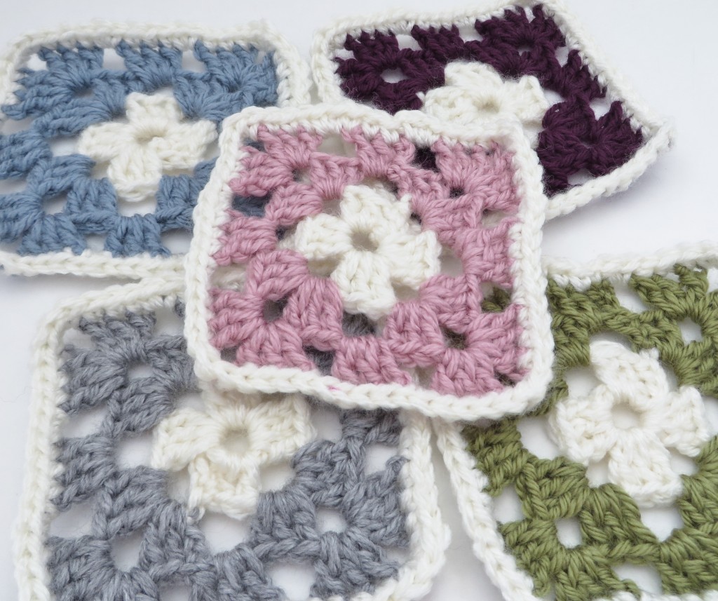 Colourful granny squares - pink, purple, blue, green and grey.