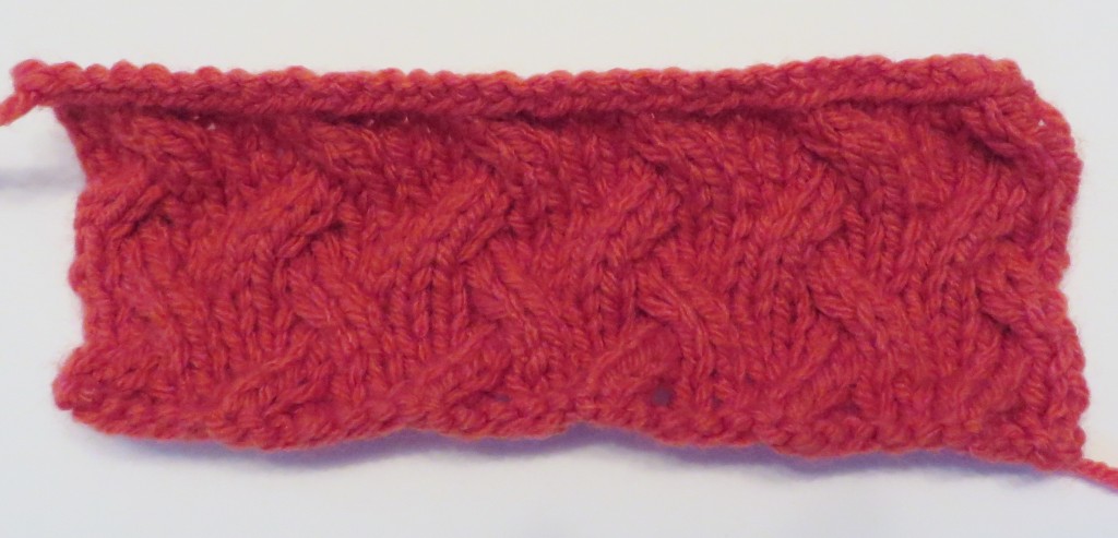 Swatch of the knitted baby blanket that I've started.