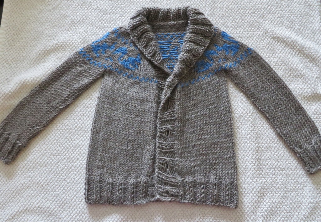 Blocking the cute baby sweater (more pics when I've attached the buttons)